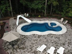 <div class='closebutton' onclick='return hs.close(this)' title='Close'></div><div class='firstH'><img src='images/logo-white-small.png'></div><h1>Free Form Fiberglass Pool</h1><p>Free Form - Laguna Deluxe Fiberglass Pool #002 by Stoker Pools</p><div class='getSocial'><h1>Share</h1><p class='photoBy'>Photo by Stoker Pools</p><iframe src='http://www.facebook.com/plugins/like.php?href=http%3A%2F%2Fstokerpools.com&send=false&layout=button_count&width=100&show_faces=false&action=like&colorscheme=light&font&height=21' scrolling='no' frameborder='0' style='border:none; overflow:hidden; width:100px; height:21px;' allowTransparency='true'></iframe><br><a href='http://pinterest.com/pin/create/button/?url=http%3A%2F%2Fwww.stokerpools.com&media=http%3A%2F%2Fwww.stokerpools.com%2Fimages%2Fgalleries%2Fconcrete%2Fwm%2Fconcrete-pool-by-stoker-pools-001.jpg&description=Pools' data-pin-do='buttonPin' data-pin-config=\'above\'><img src='http://assets.pinterest.com/images/pidgets/pin_it_button.png' /></a><br></div>