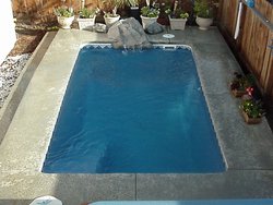 <div class='closebutton' onclick='return hs.close(this)' title='Close'></div><div class='firstH'><img src='images/logo-white-small.png'></div><h1>Rectangle Fiberglass Pool</h1><p>Rectangle - Tropicana Fiberglass Pool #002 by Stoker Pools</p><div class='getSocial'><h1>Share</h1><p class='photoBy'>Photo by Stoker Pools</p><iframe src='http://www.facebook.com/plugins/like.php?href=http%3A%2F%2Fstokerpools.com&send=false&layout=button_count&width=100&show_faces=false&action=like&colorscheme=light&font&height=21' scrolling='no' frameborder='0' style='border:none; overflow:hidden; width:100px; height:21px;' allowTransparency='true'></iframe><br><a href='http://pinterest.com/pin/create/button/?url=http%3A%2F%2Fwww.stokerpools.com&media=http%3A%2F%2Fwww.stokerpools.com%2Fimages%2Fgalleries%2Fconcrete%2Fwm%2Fconcrete-pool-by-stoker-pools-001.jpg&description=Pools' data-pin-do='buttonPin' data-pin-config=\'above\'><img src='http://assets.pinterest.com/images/pidgets/pin_it_button.png' /></a><br></div>